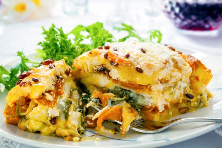 Vegetarian lasagna or lasagne. Made with sweet potato, pumpkin, spinach and pine nuts.