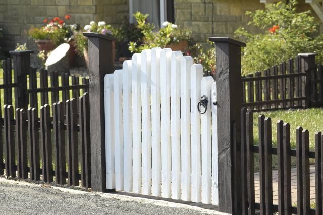 Low and Lovely Brown Wooden Fence With White Gate