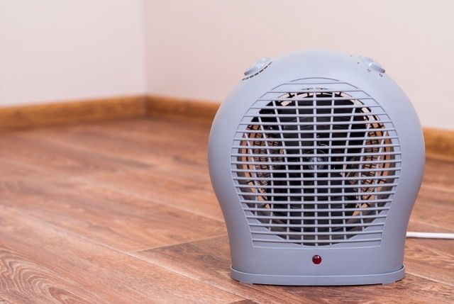 Portable electric heater fan type is on the floor