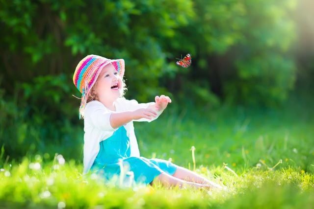 Girl playing with the butterfly