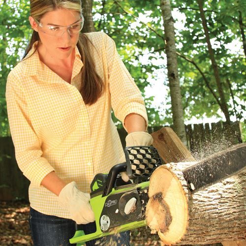 Woman cutting wood using log splitter