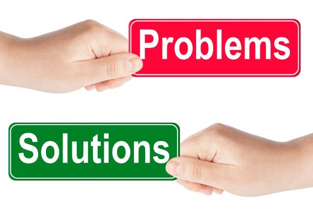 Problems and Solutions traffic sign in the hand on the white background