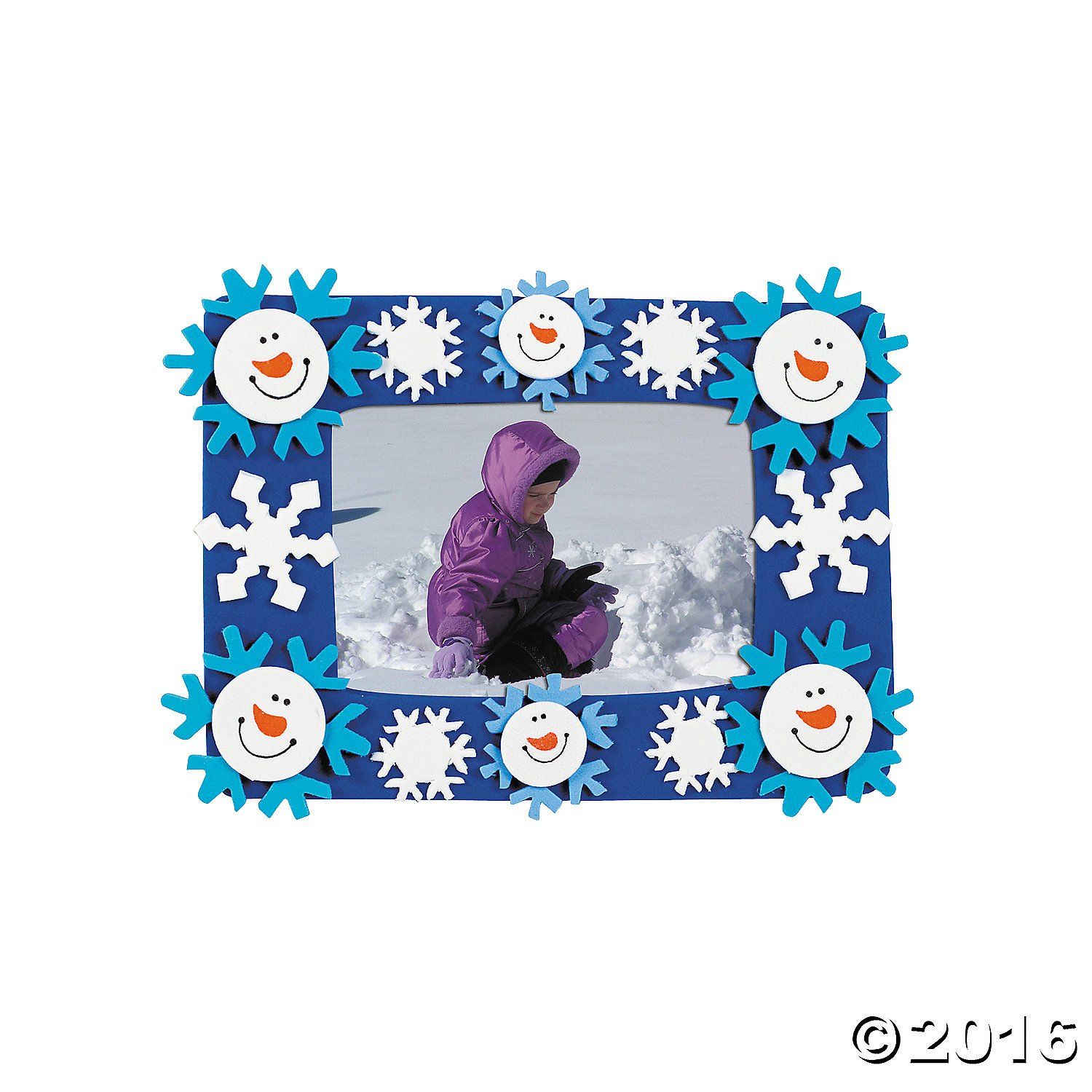 A picture of a child in purple winter coat framed by snowman head and blue and white snowflake