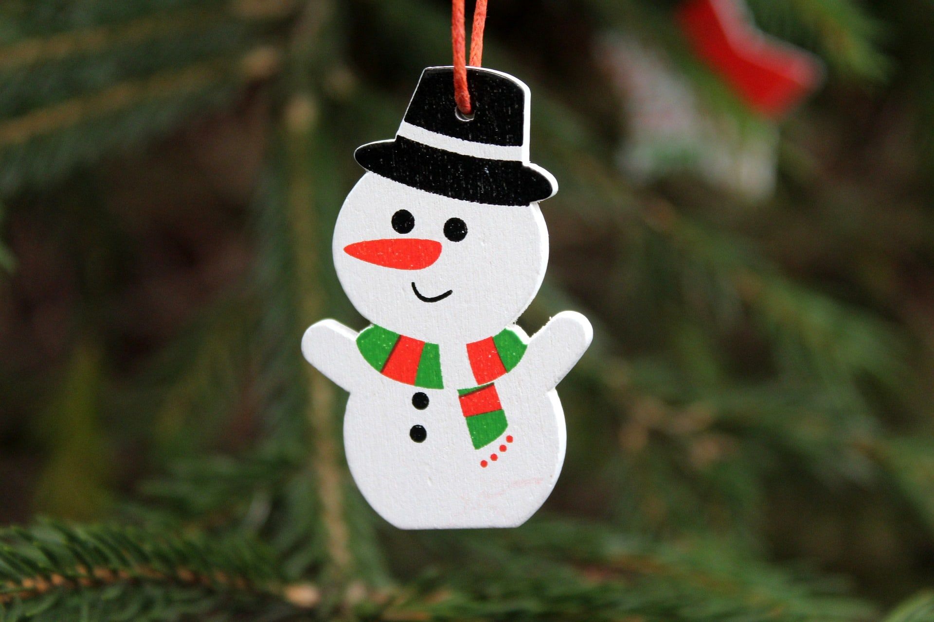 Hanging Snowman made of styrofoam and painted with hat, scarf and eyes and smile