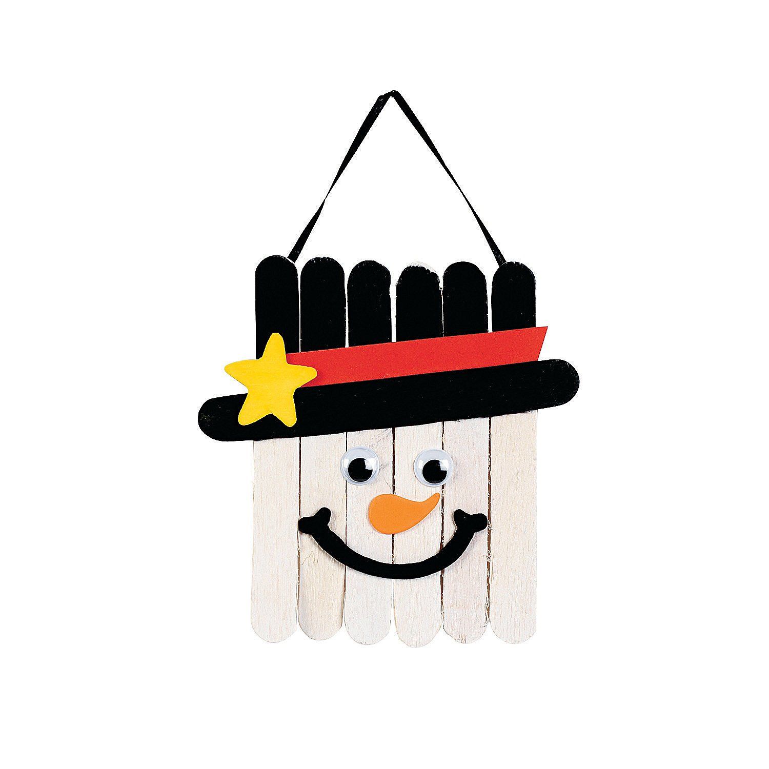 Popsicle sticks formed a face of snowman painted with black and white attached with googly eyes and a smile
