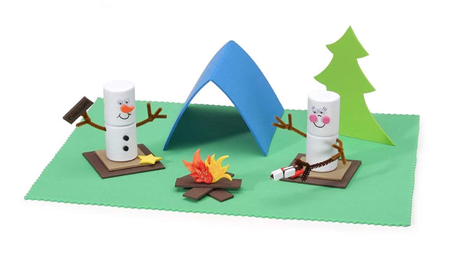 Two DIY snowman and a miniature bonfire with tent and pine tree in the background