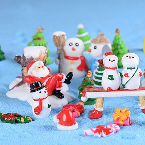 Miniature santa toy relaxing on the center surrounded by several snowman with different dress decorations
