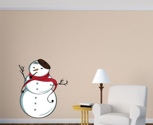 Graceful snowman vinyl decal on a wall with cushion chair, table and lampstand