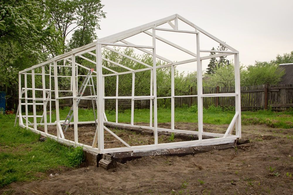 Construction of a small greenhouse in a garden