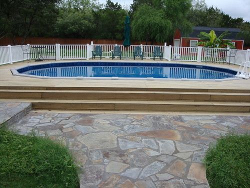 nice pool walkway with stone and grass