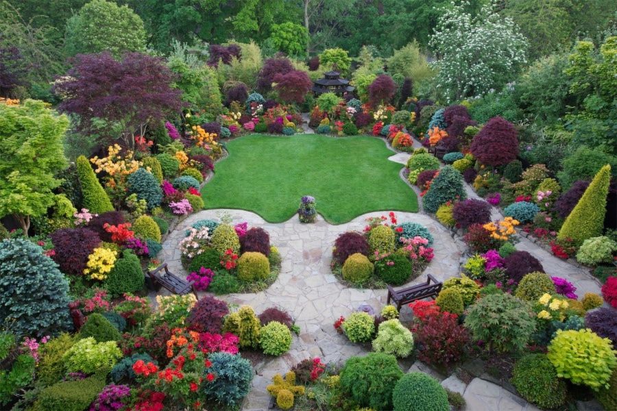 a garden that has an outstanding landscape and colorful flowers