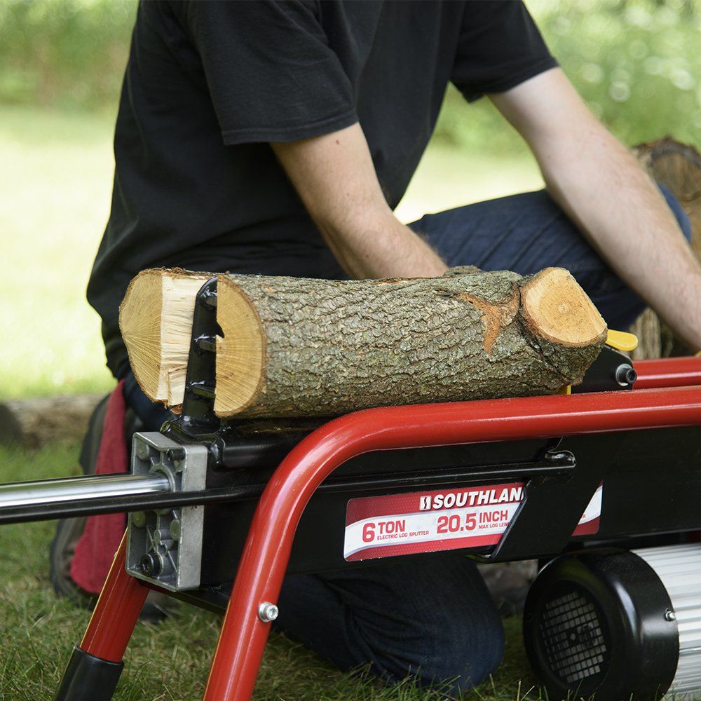a man using log splitter