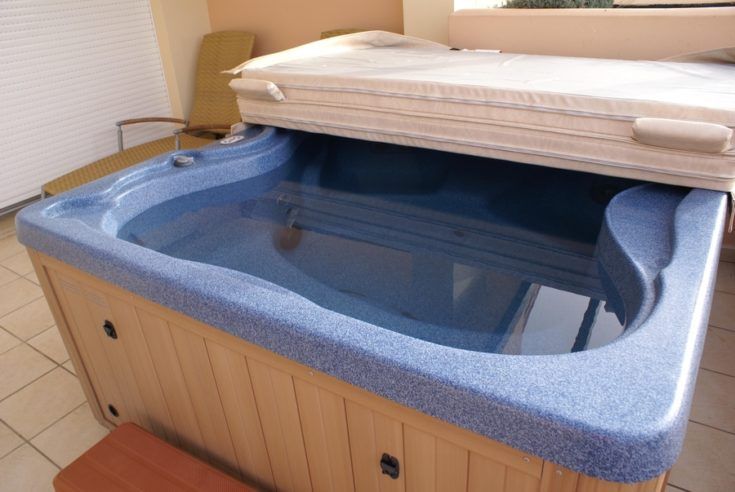 Blue ceramic hot tub wooden contruction with cover