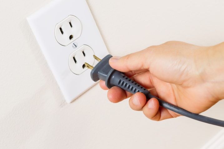 Plugging in to a power outlet.