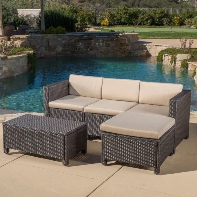 Furst 5 Piece Sectional Seating Group with Cushions in the pool area
