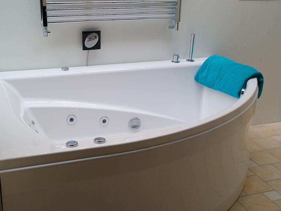 Bathtub jacuzzi in a modern trendy clean design white batroom