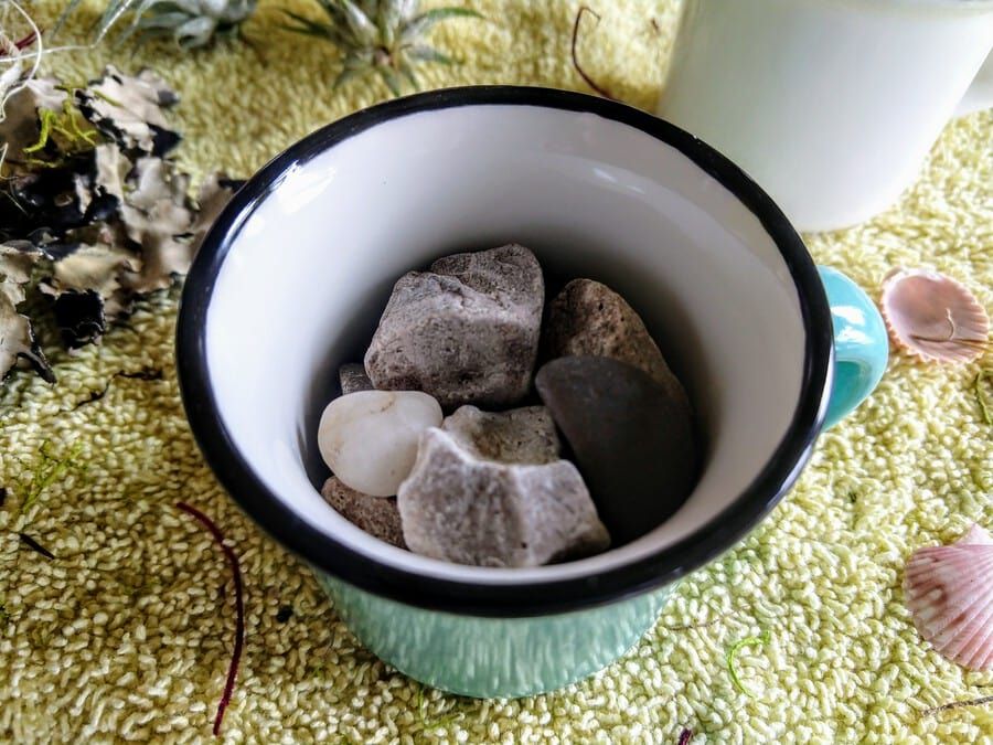Small rocks put inside a cup.