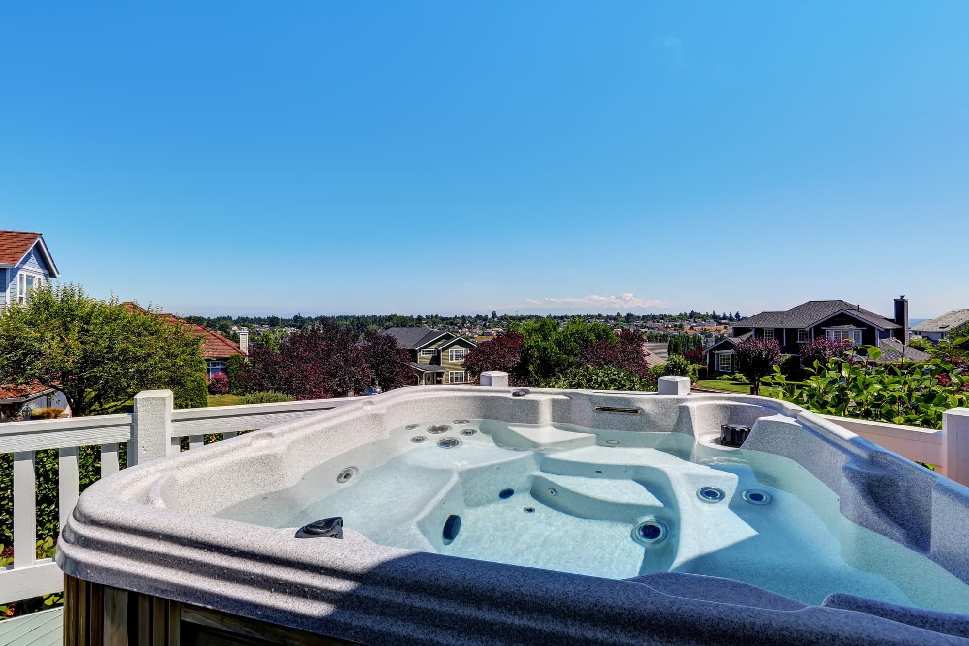 Close-up of hot tub. Luxury house exterior. Blue sky background. Northwest, USA