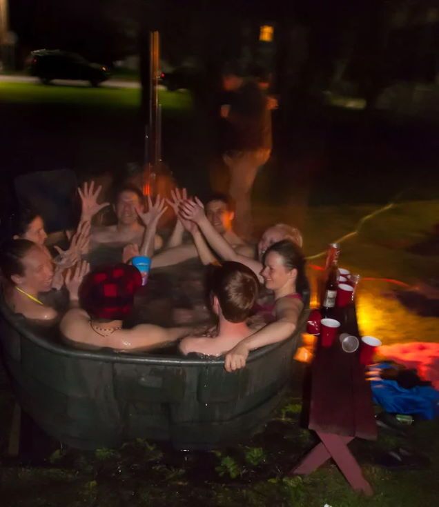 men and women inside the hot tub