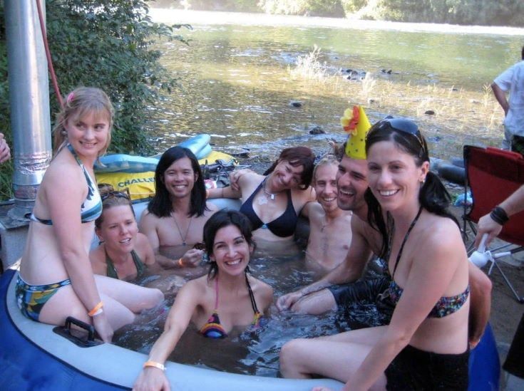 group of people inside the hot tub during day time