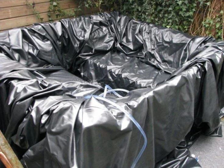 DIY Hot Tub Jacuzzi in gray cover with hose