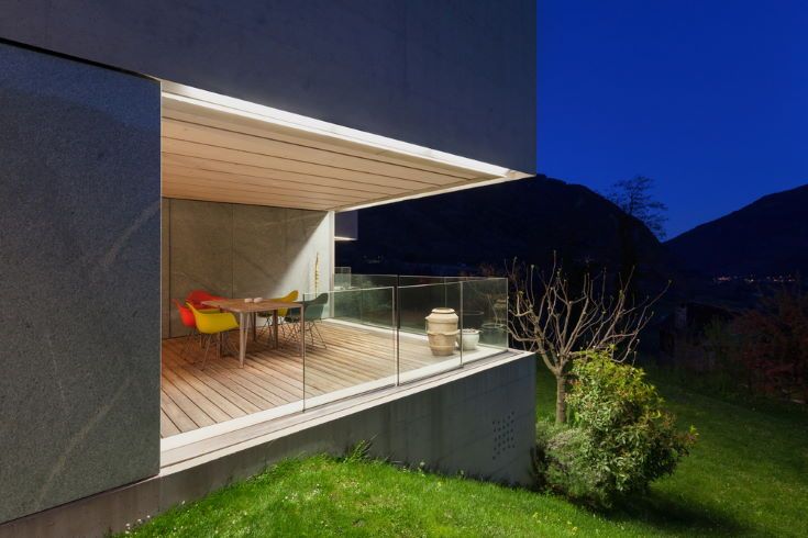 Architecture modern design, concrete house, lit terrace at night