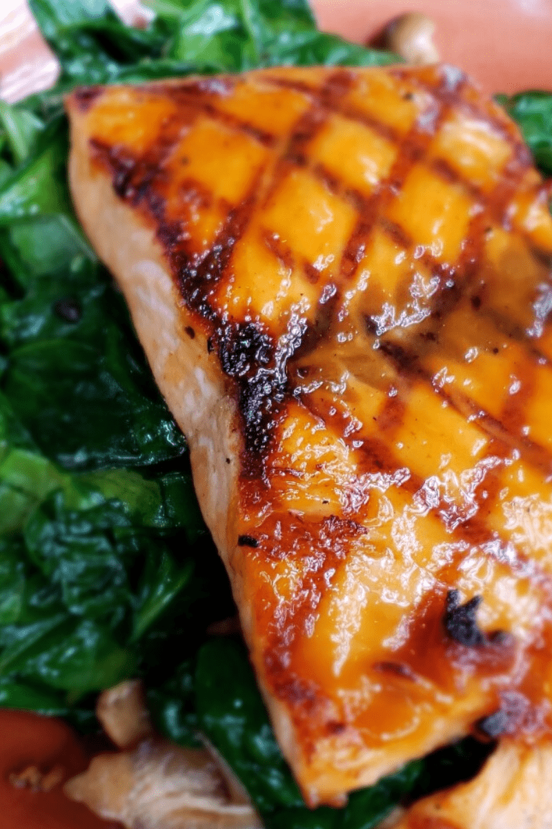 grilled salmon on sauteed greens