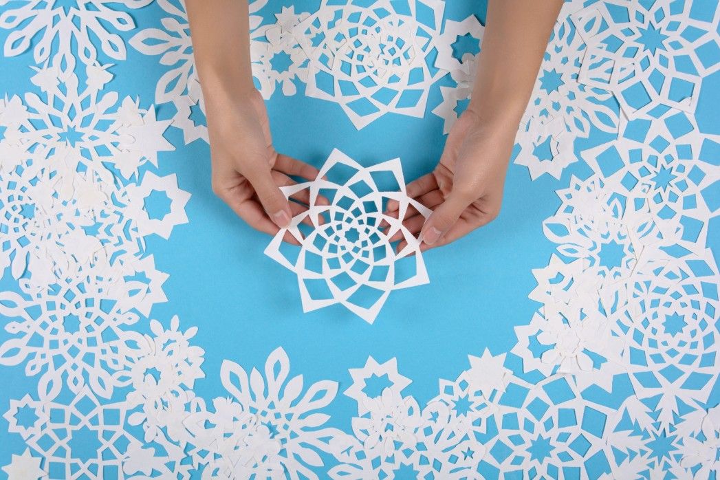 paper snowflakes on blue background
