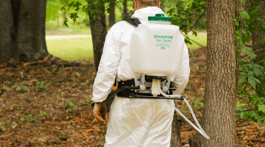 best backpack sprayer wide featured man wears backpack sprayer to treat wooded area
