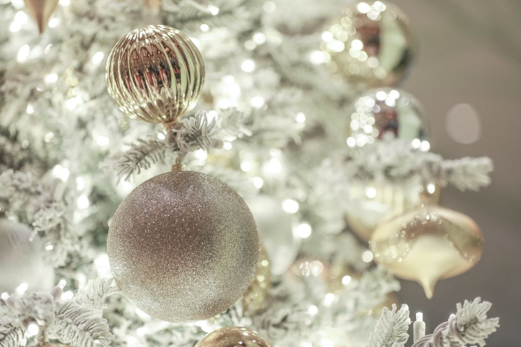 White Christmas tree with elegant gold and silver ornaments glitter, glossy, shiny,