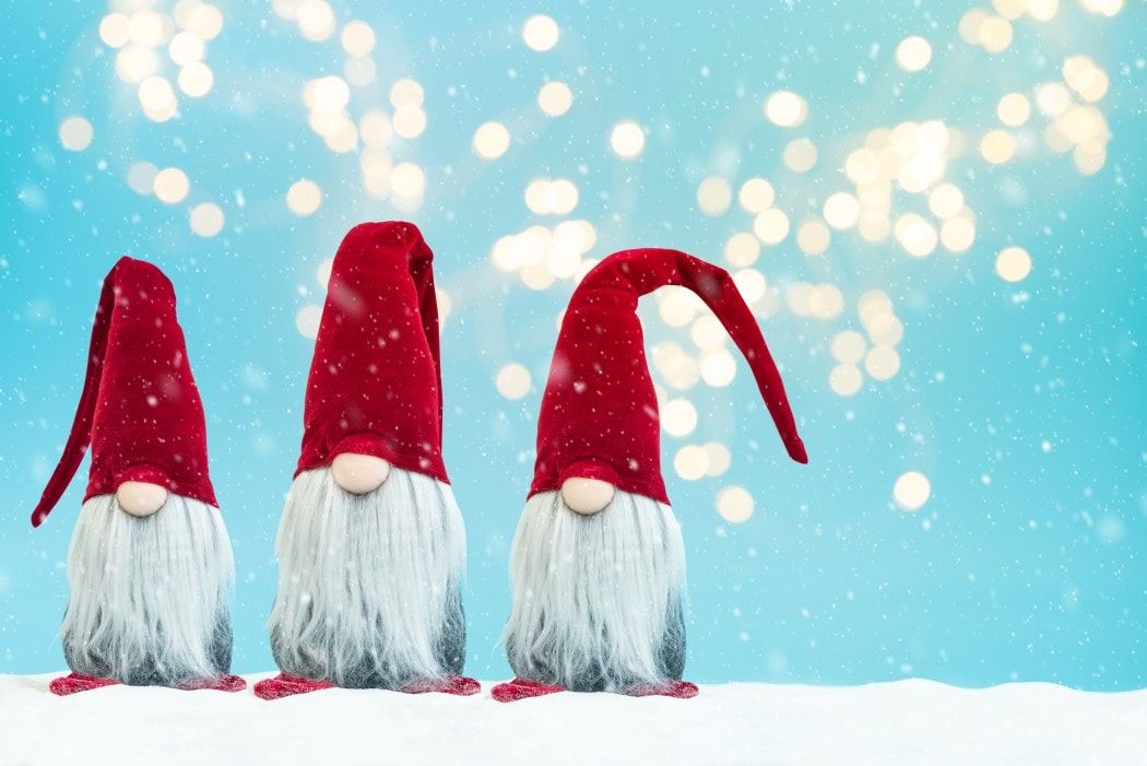 three tomte traditional christmas noel gnomes on blue background