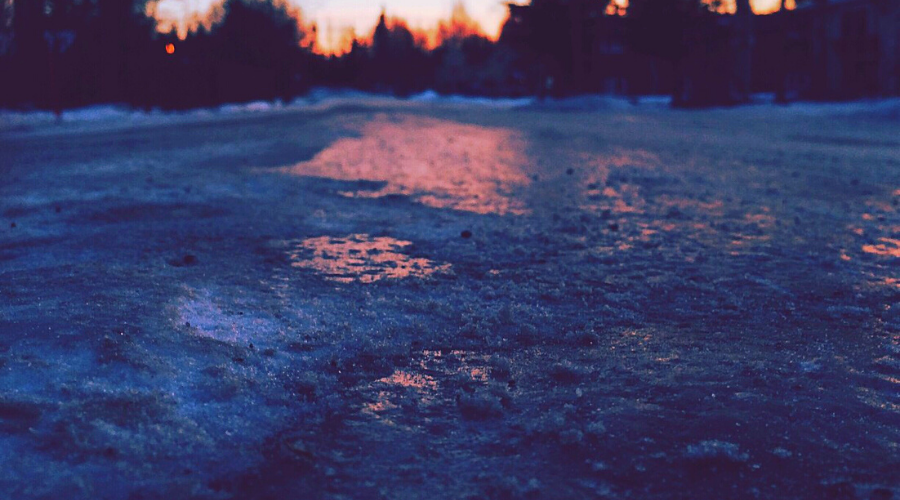 beet juice ice melt wide icy road dusk