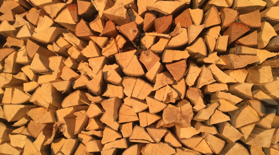 a stack of split pinewood drying pine for firewood