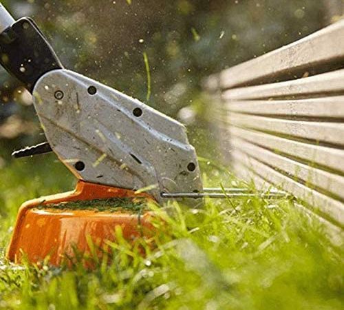 The cutting head of a Stihl weed eater in action.