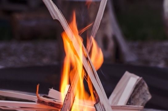 burning kindling indoor fireplace closeup