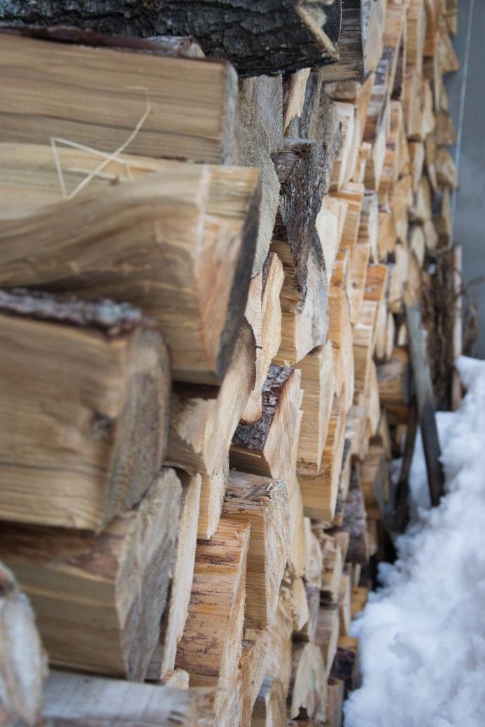 firewood seasoning outdoors snow tall