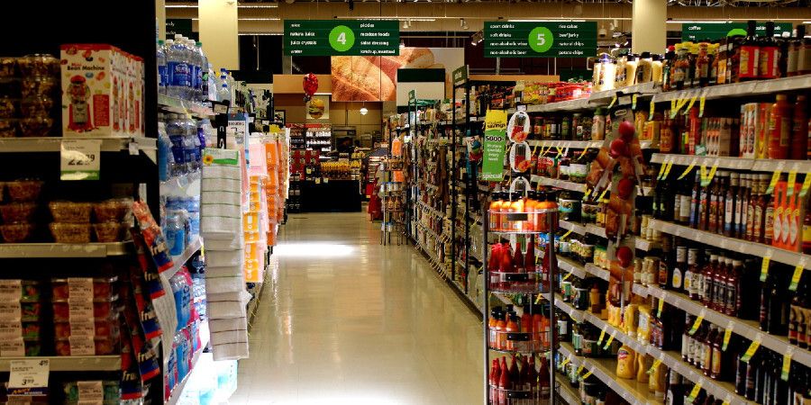 A grocery store aisle with canned food.