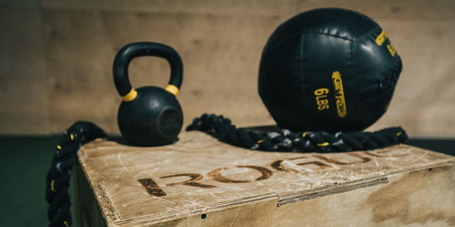 Medicine ball, kettlebell and ropes on a Crossfit style plyometric box