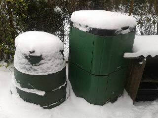 Three Compost Bins Covered In Snow 