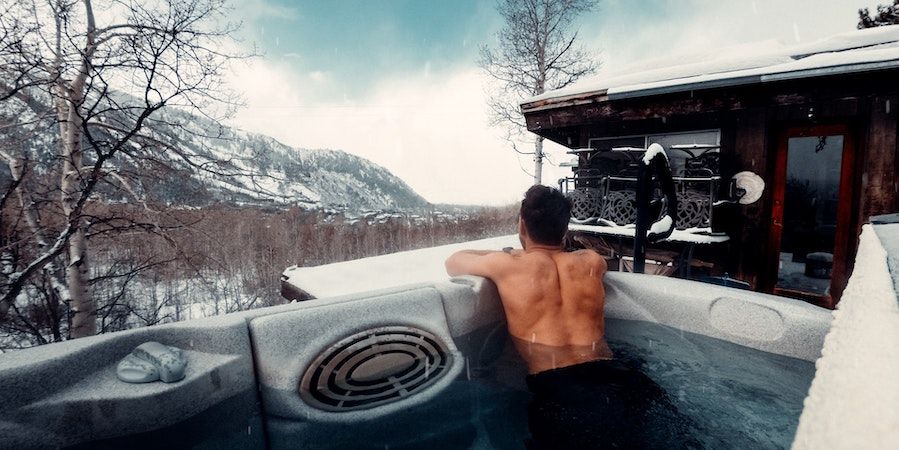 Man In Hot Tub In The Snow