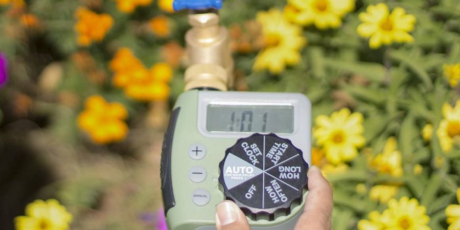 Setting the watering time on an Orbit hose watering timer.
