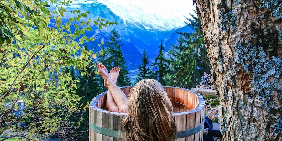 Woman In Wooden Hot Tub In The Woods