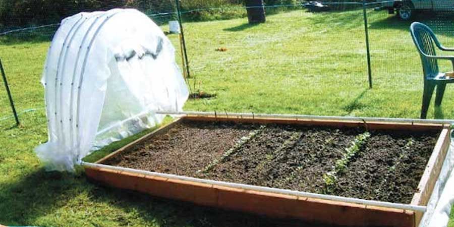 Hoop House Folded To One Side Of Garden Bed