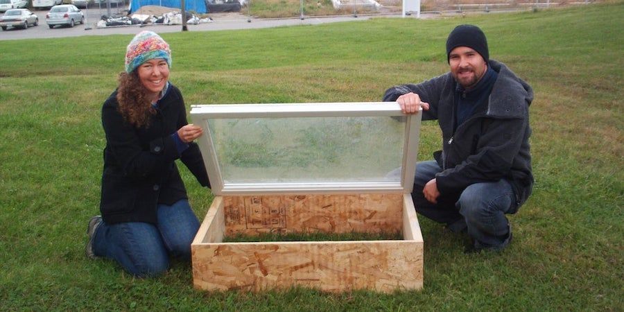 Two People With Recycled Cold Frame 