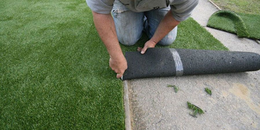 Person Cutting Artificial Grass