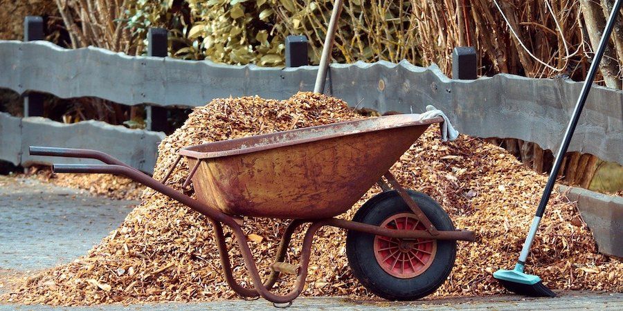 Wheelbarrow In Front Of Mulch