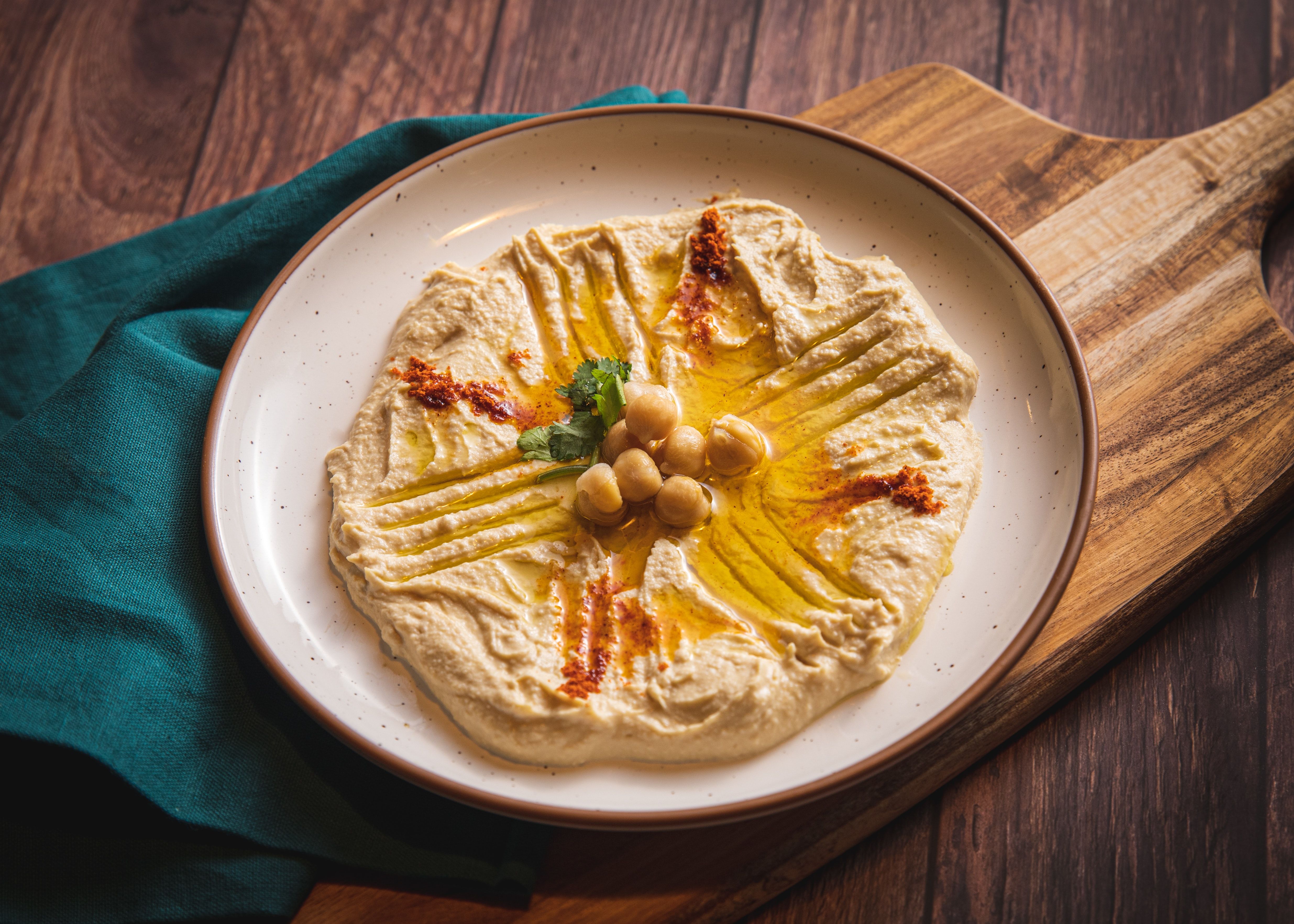 Fresh hummus with olive oil and spices