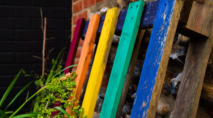 Colorful pallet leaning against wall