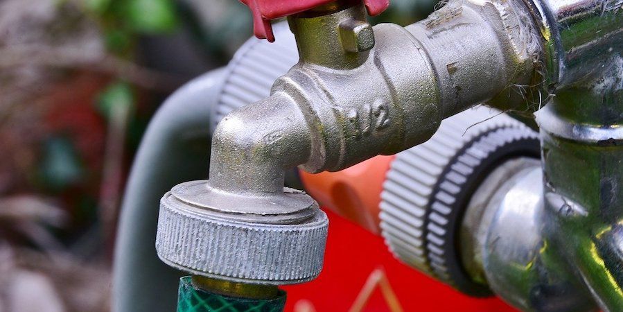 Garden faucet with hose fittings 