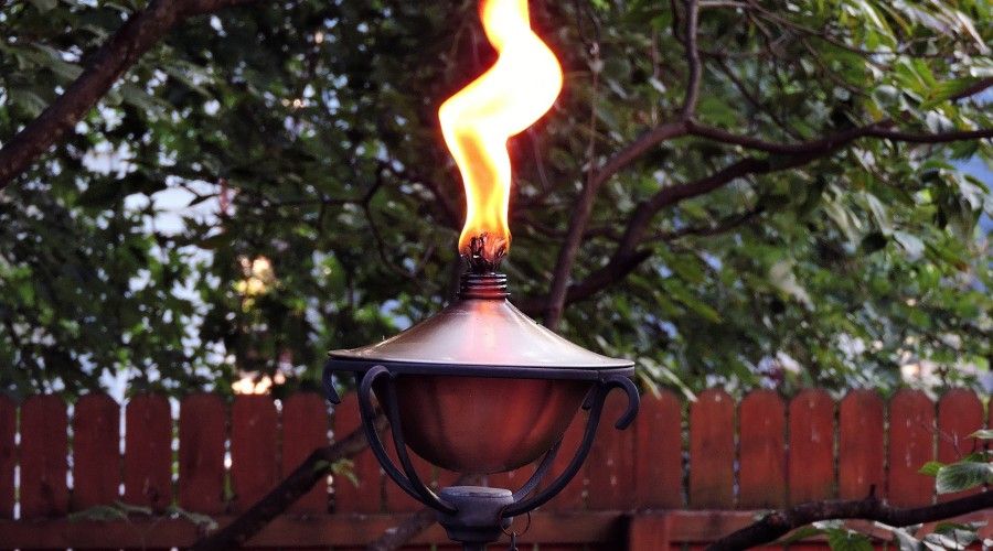 lit outdoor oil torch-style light